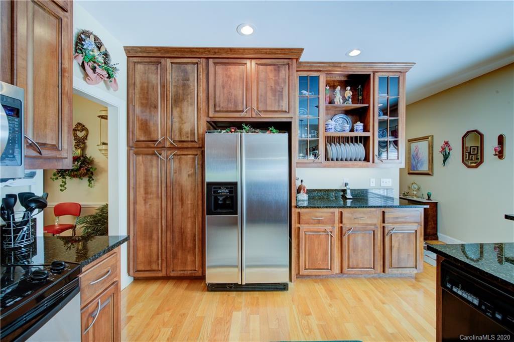 146 Pumkin Patch Road Rutherfordton, NC 28139 - Photo 17 of 48 a kitchen with stainless steel appliances granite countertop a refrigerator and a sink