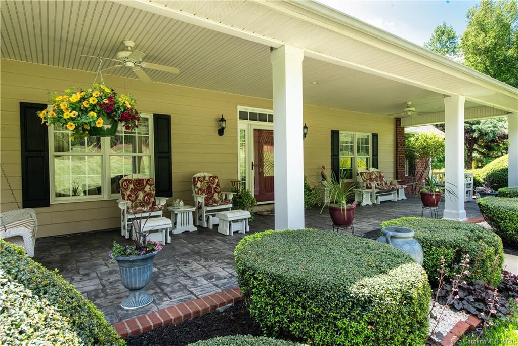 146 Pumkin Patch Road Rutherfordton, NC 28139 - Photo 3 of 48 a view of a patio with couches table and chairs and potted plants