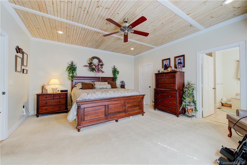 146 Pumkin Patch Road Rutherfordton, NC 28139 - Photo 23 of 48 a bed room with a bed and a ceiling fan