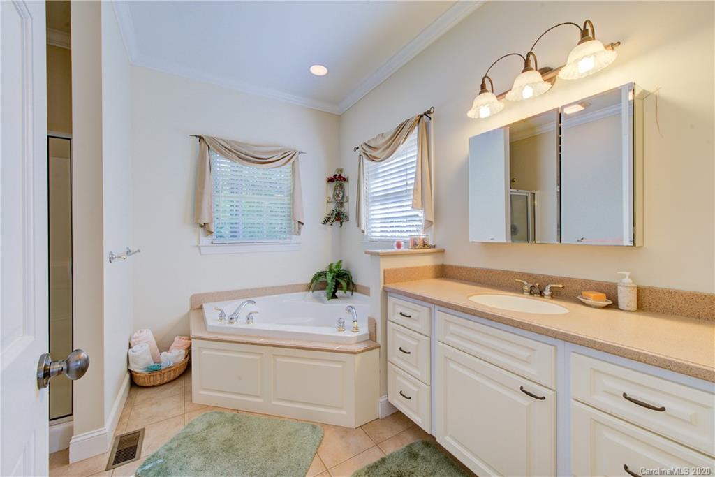 146 Pumkin Patch Road Rutherfordton, NC 28139 - Photo 26 of 48 a bathroom with a double vanity sink mirror and toilet