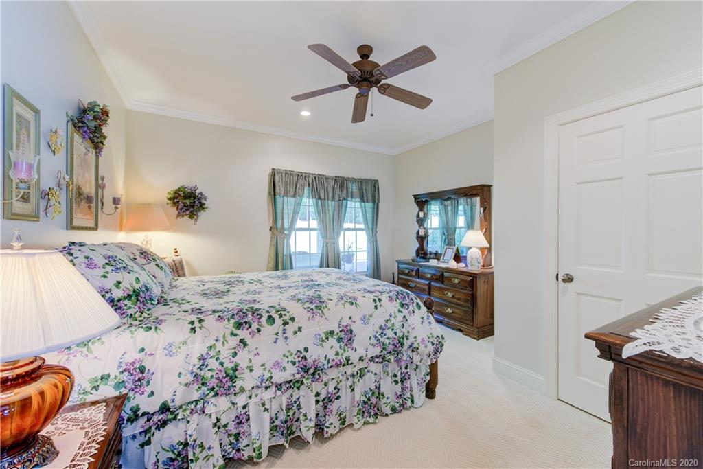 146 Pumkin Patch Road Rutherfordton, NC 28139 - Photo 29 of 48 a bedroom with a bed and ceiling fan