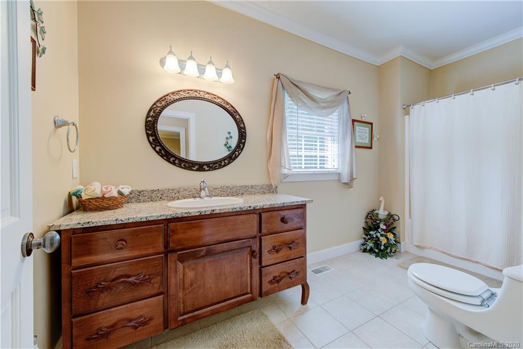 146 Pumkin Patch Road Rutherfordton, NC 28139 - Photo 32 of 48 a bathroom with a toilet a sink and a mirror