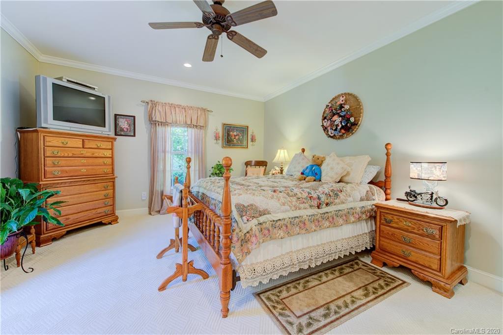 146 Pumkin Patch Road Rutherfordton, NC 28139 - Photo 35 of 48 a bedroom with a bed and ceiling fan