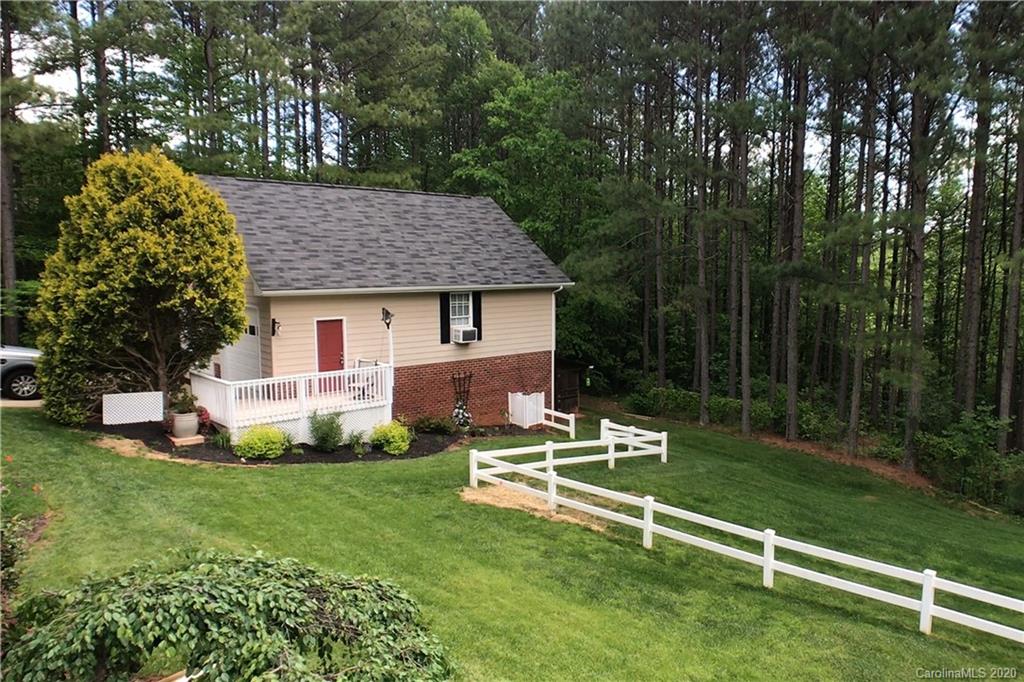 146 Pumkin Patch Road Rutherfordton, NC 28139 - Photo 46 of 48 a view of a house with backyard sitting area and garden