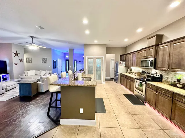 a bathroom with a sink mirror vanity and toilet