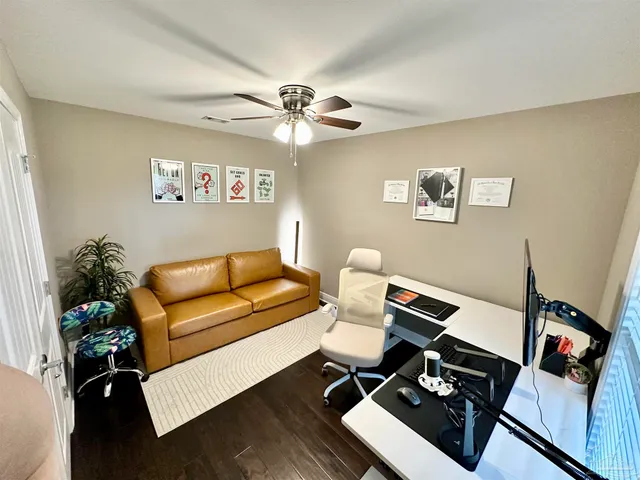 a work room with furniture and a window