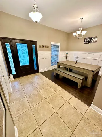 a front view of house with yard and outdoor seating