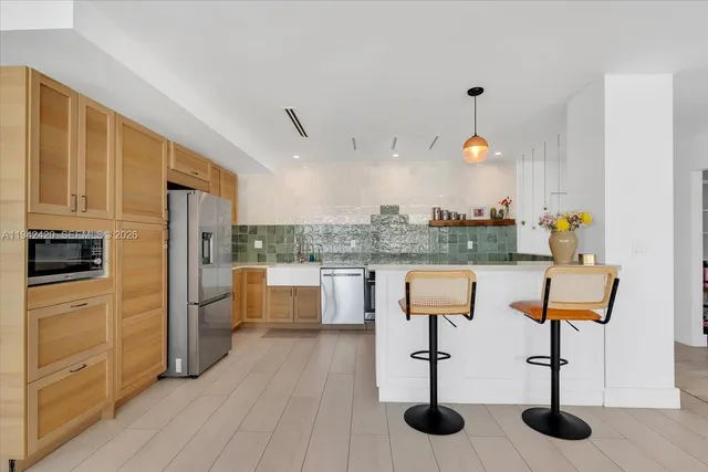 a view of a livingroom with furniture and wooden floor
