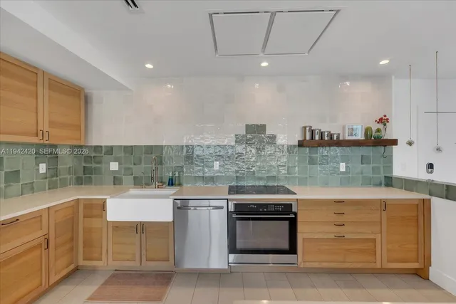 a view of a balcony with furniture and floor to ceiling window