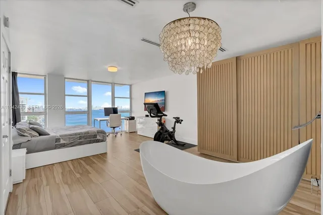 a bathroom with a sink toilet a mirror and shower