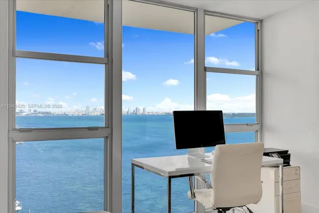 a living room with lots of furniture and a flat screen tv