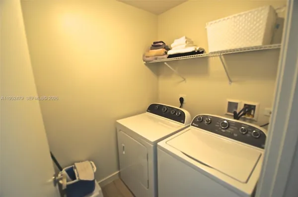 a utility room with dryer and washer