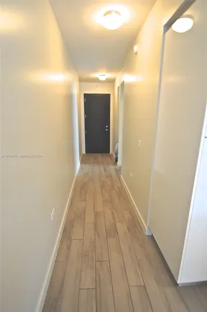 a view of hallway with a large mirror