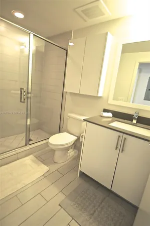 a bathroom with a sink and a shower