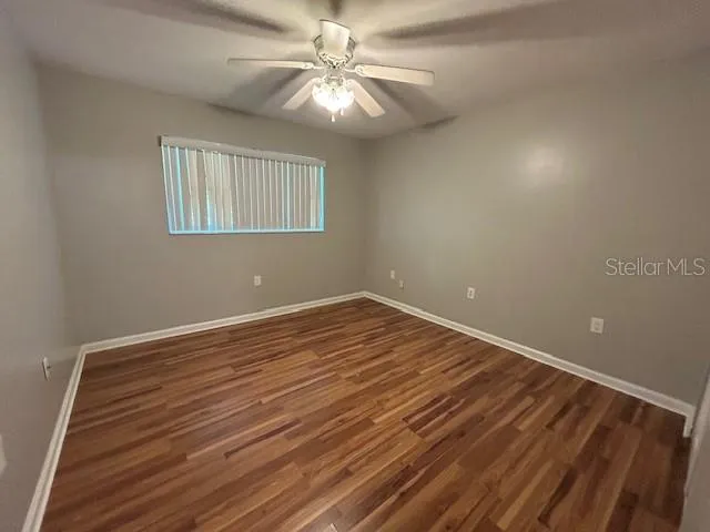 a view of room with window and ceiling fan