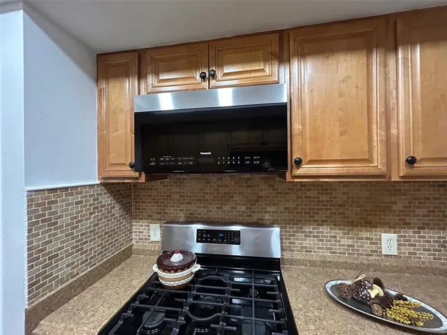 a kitchen with a stove and a microwave