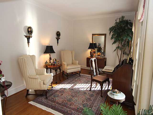 Formal living room has gleaming hardwood floors and is directly accessible from the entry foyer. Living Room
