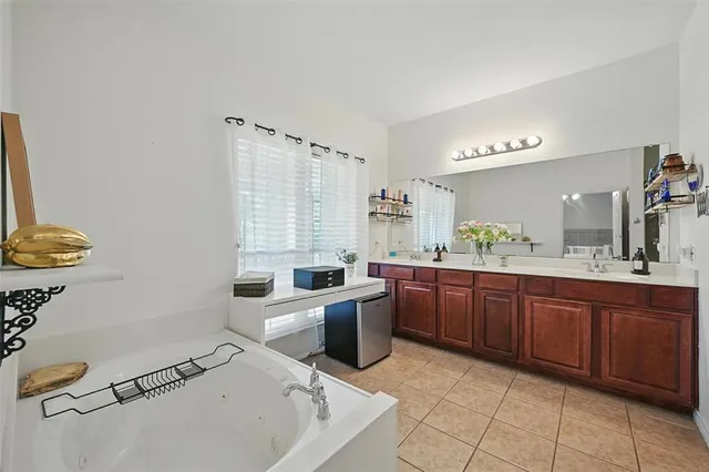 a room with a sink and cabinets