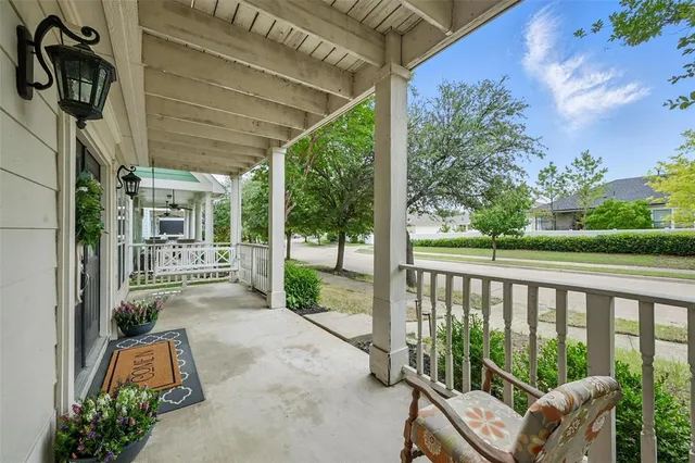a view of a porch with furniture and garden