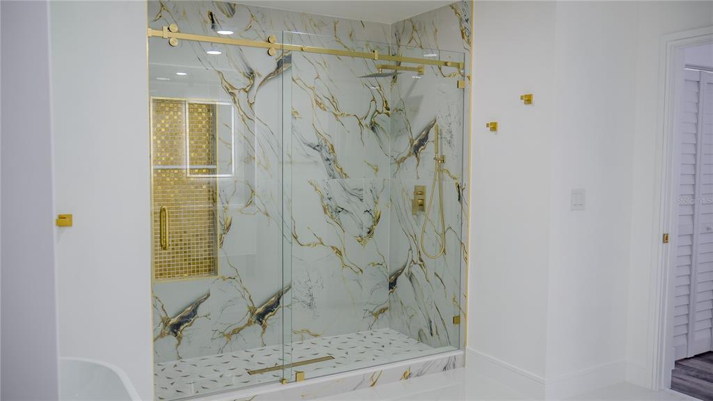 7984 Floral Drive Weeki Wachee, FL 34607 - Photo 22 of 31 a bathroom with a shower
