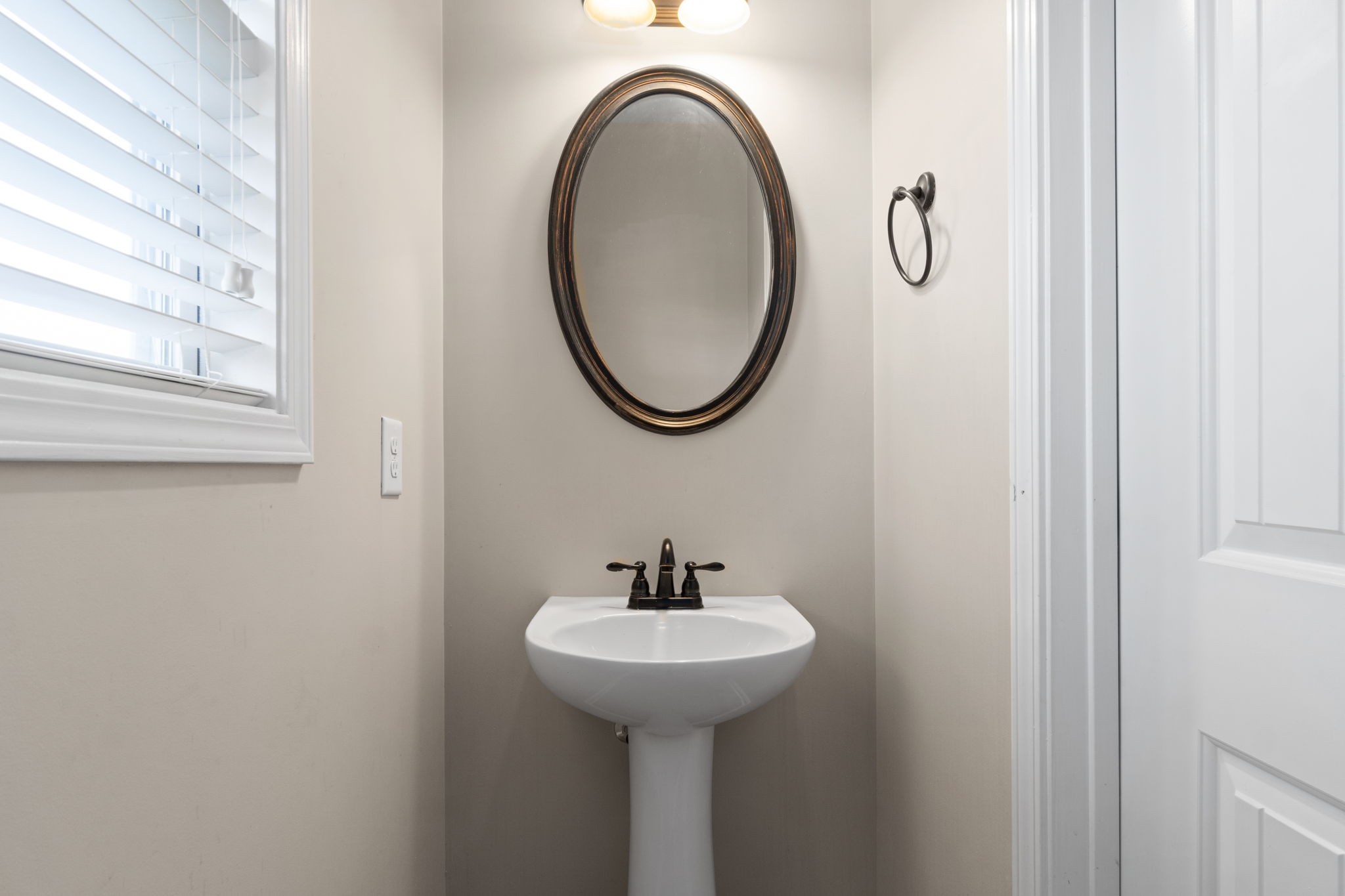 1431 Raven Road Clarksville, TN 37042 - Photo 15 of 32 a bathroom with a sink and a mirror