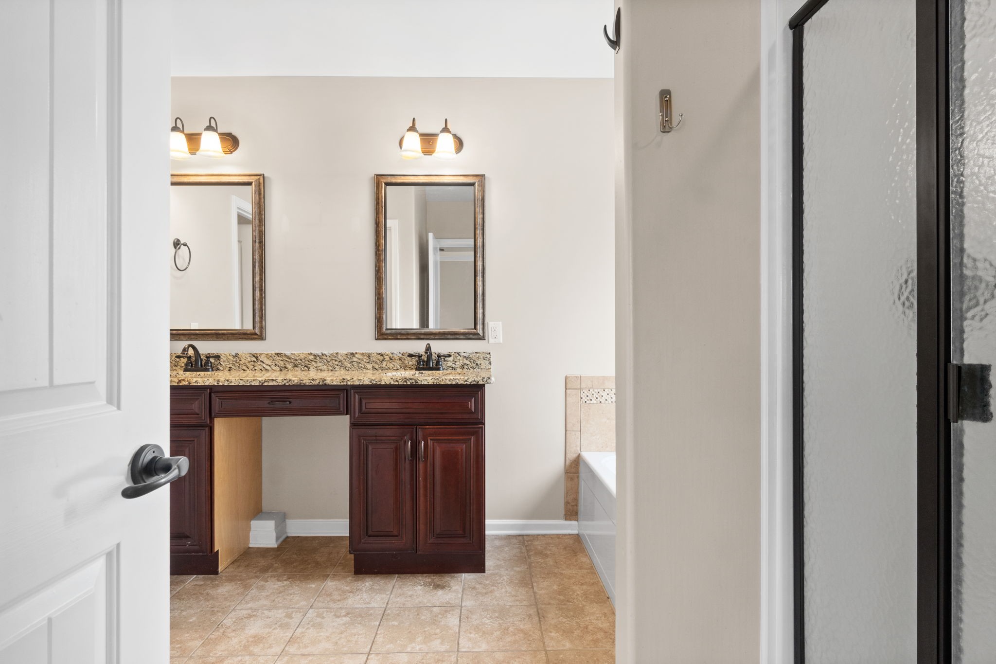 1431 Raven Road Clarksville, TN 37042 - Photo 19 of 32 a bathroom with a granite countertop sink and a mirror