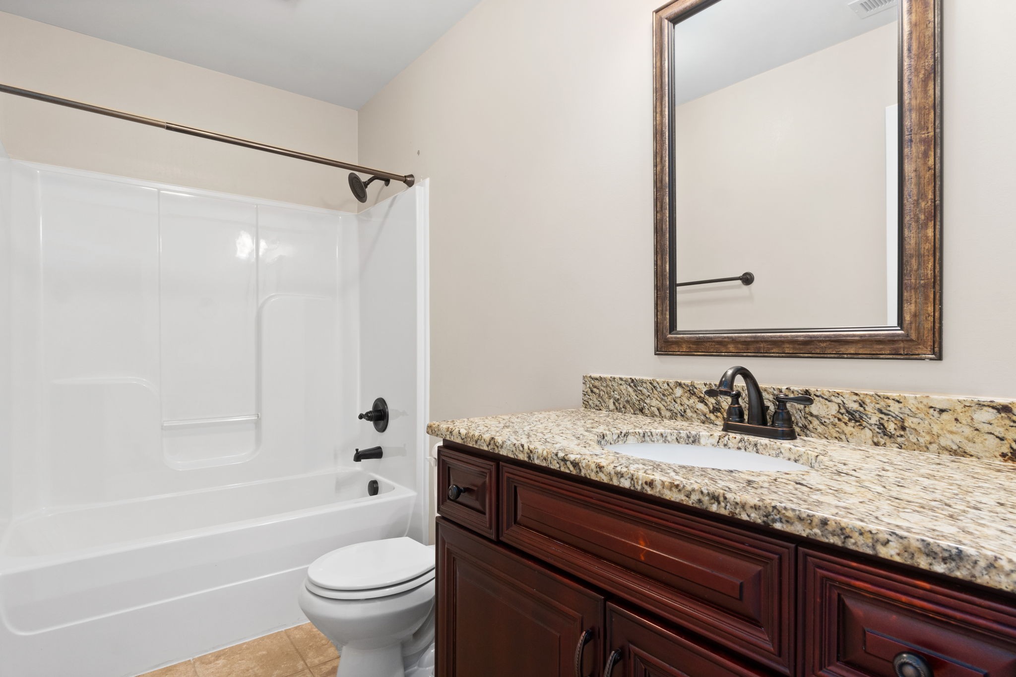 1431 Raven Road Clarksville, TN 37042 - Photo 23 of 32 a bathroom with a granite countertop sink toilet and shower