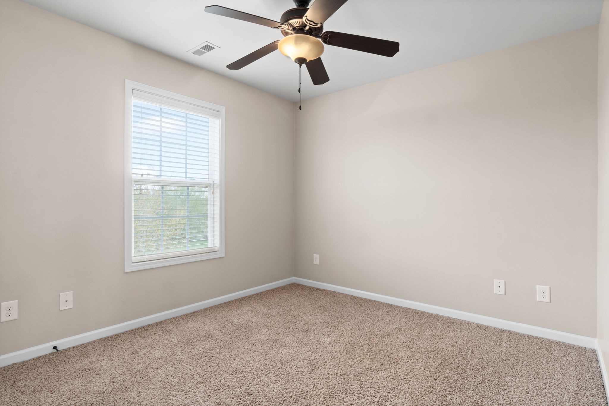 1431 Raven Road Clarksville, TN 37042 - Photo 24 of 32 an empty room with a window and a fan