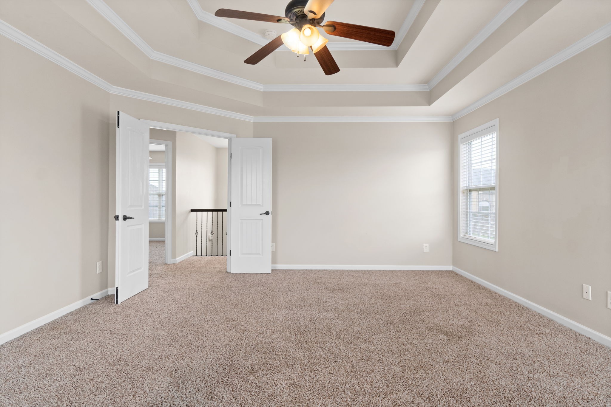 1431 Raven Road Clarksville, TN 37042 - Photo 25 of 32 an empty room with chandelier fan and windows