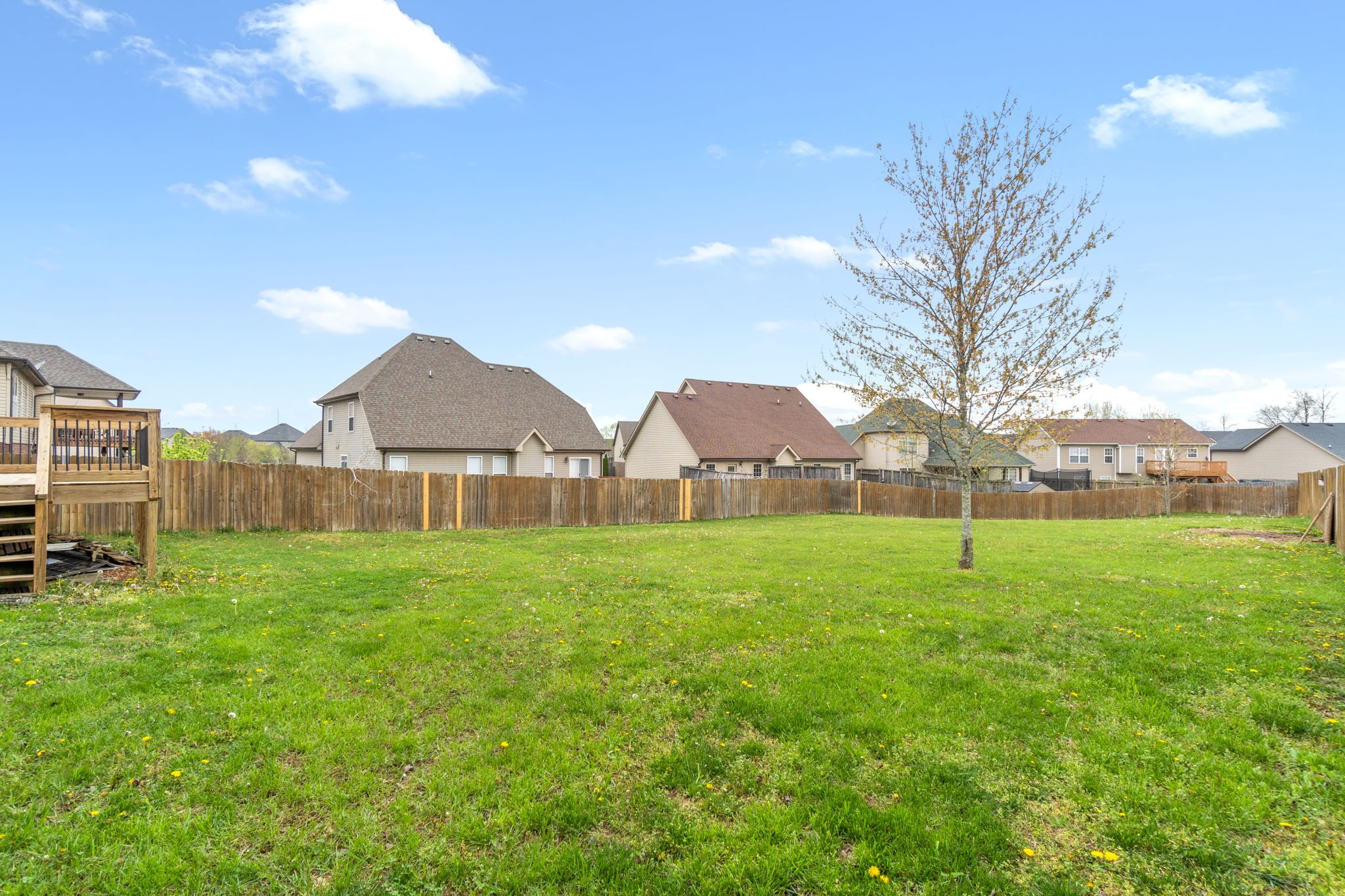 1431 Raven Road Clarksville, TN 37042 - Photo 30 of 32 a view of a big yard with a house in the background