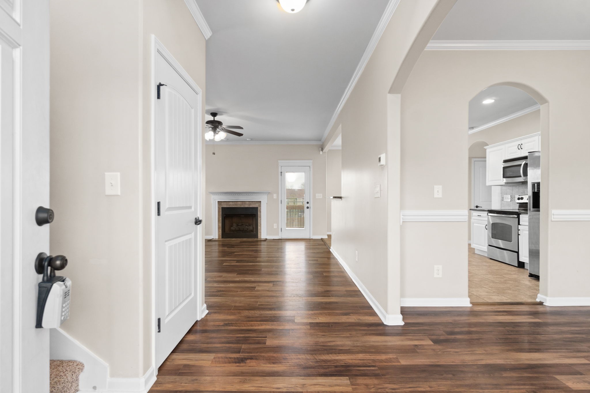 1431 Raven Road Clarksville, TN 37042 - Photo 3 of 32 a view of a hallway with wooden floor and staircase