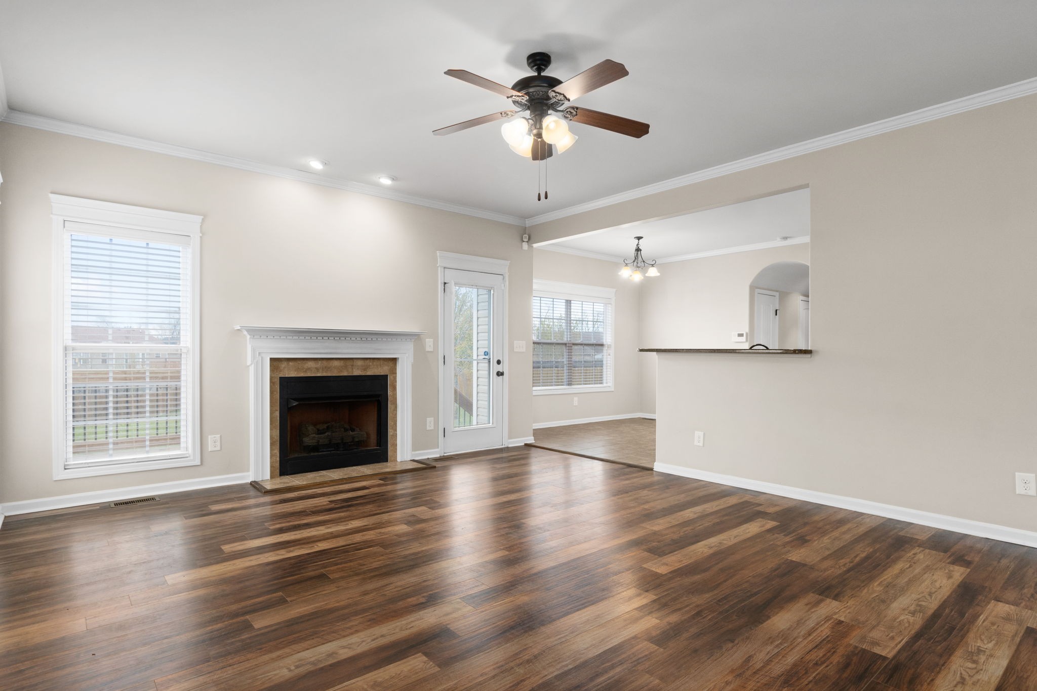 1431 Raven Road Clarksville, TN 37042 - Photo 8 of 32 a view of empty room with wooden floor and fireplace