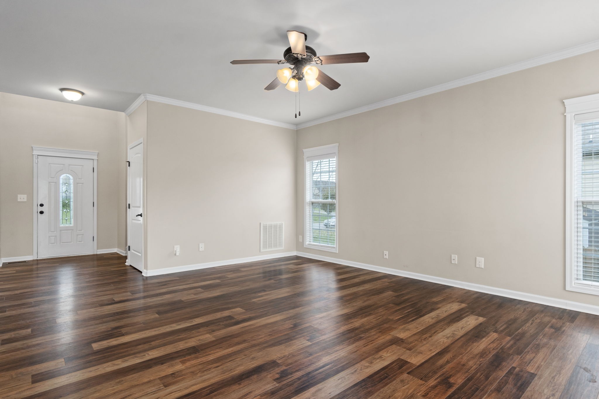 1431 Raven Road Clarksville, TN 37042 - Photo 10 of 32 a view of an empty room with wooden floor and a window