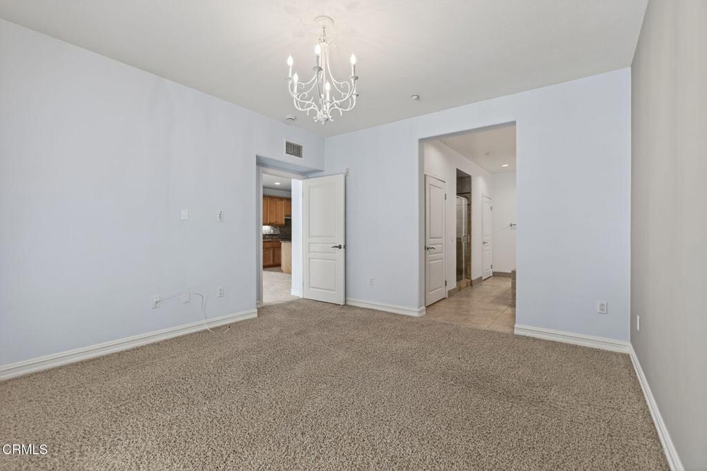 1423 Windshore Way Oxnard, CA 93035 - Photo 47 of 77 a view of a chandelier in big room and chandelier