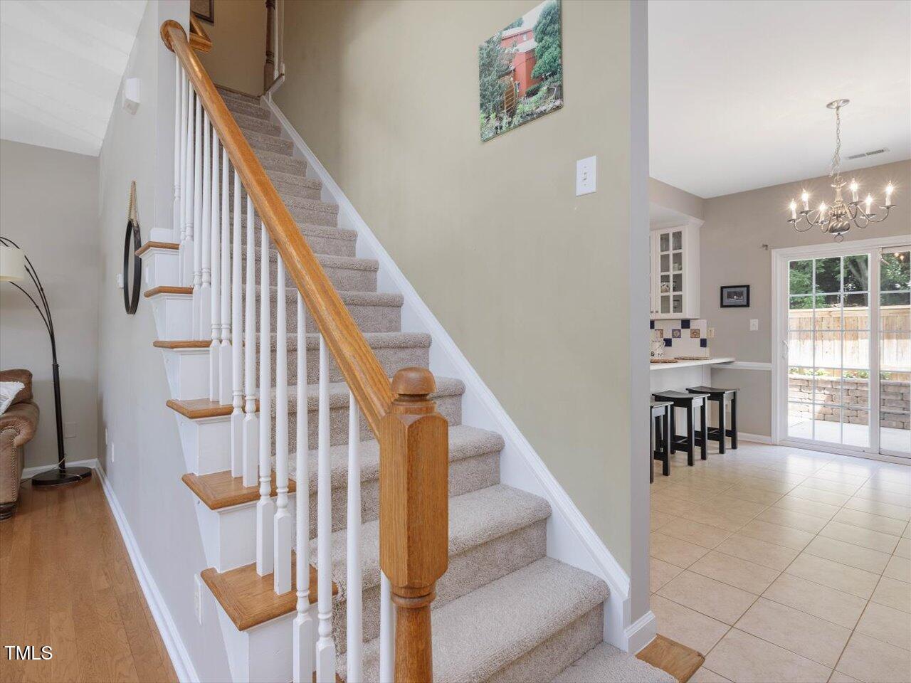 2021 Rivergate Road, Unit 102 Raleigh, NC 27614 - Photo 20 of 42 a view of entryway and hall with wooden floor