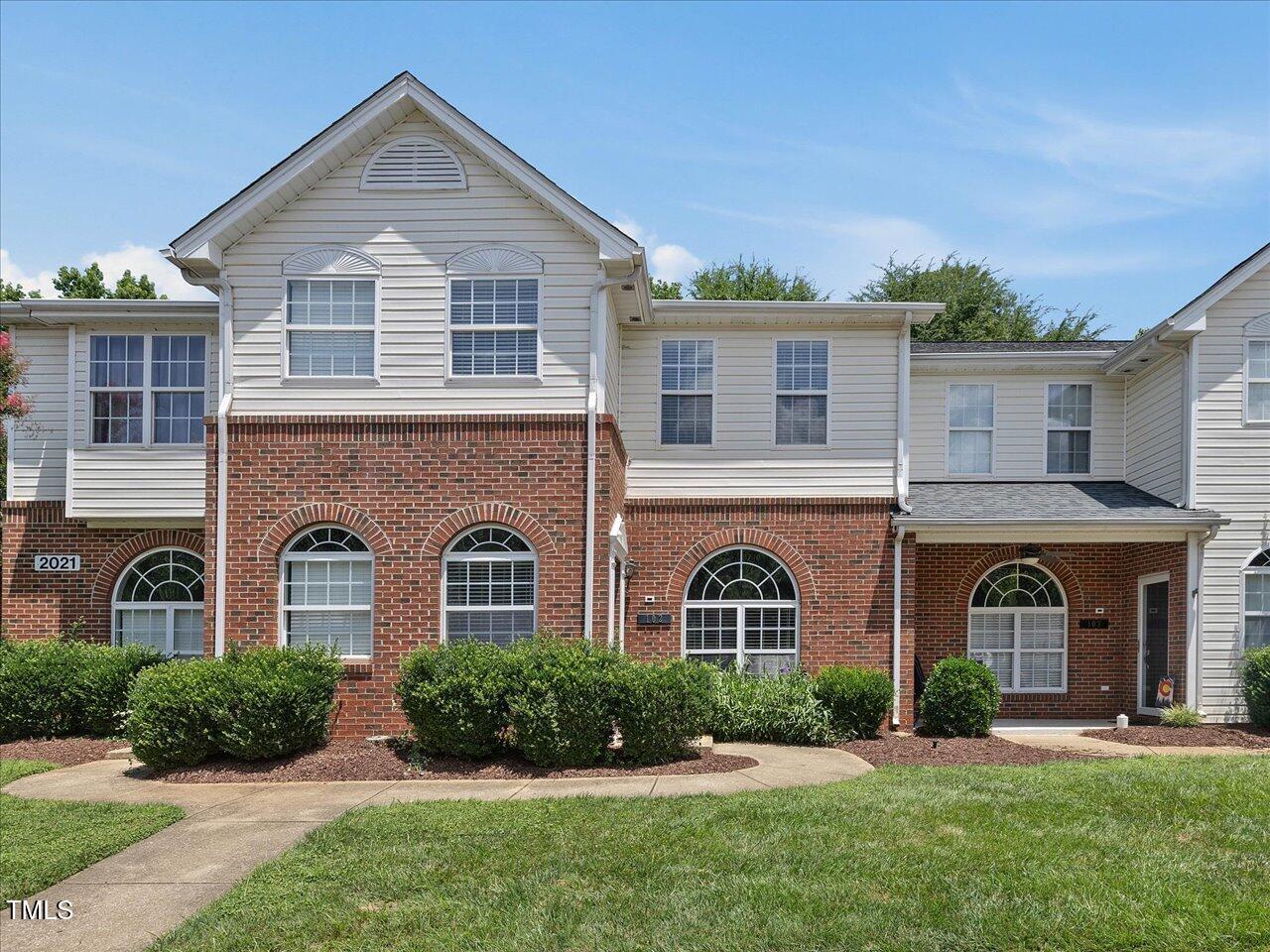 2021 Rivergate Road, Unit 102 Raleigh, NC 27614 - Photo 2 of 42 a front view of a house with a yard