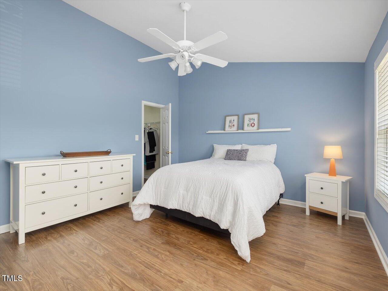 2021 Rivergate Road, Unit 102 Raleigh, NC 27614 - Photo 23 of 42 a bedroom with a bed and a dresser