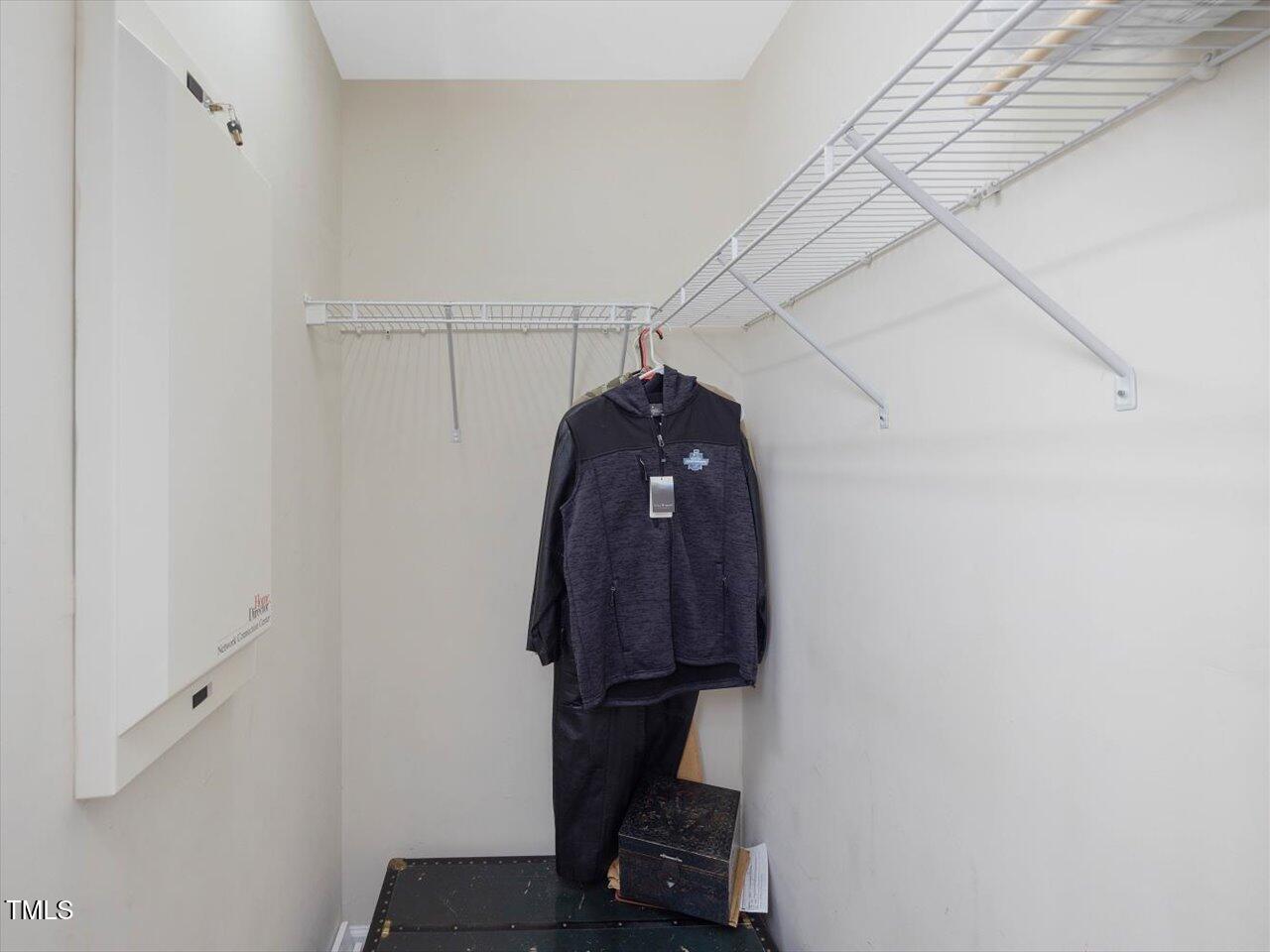 2021 Rivergate Road, Unit 102 Raleigh, NC 27614 - Photo 25 of 42 a view of a room with rack and wooden floor