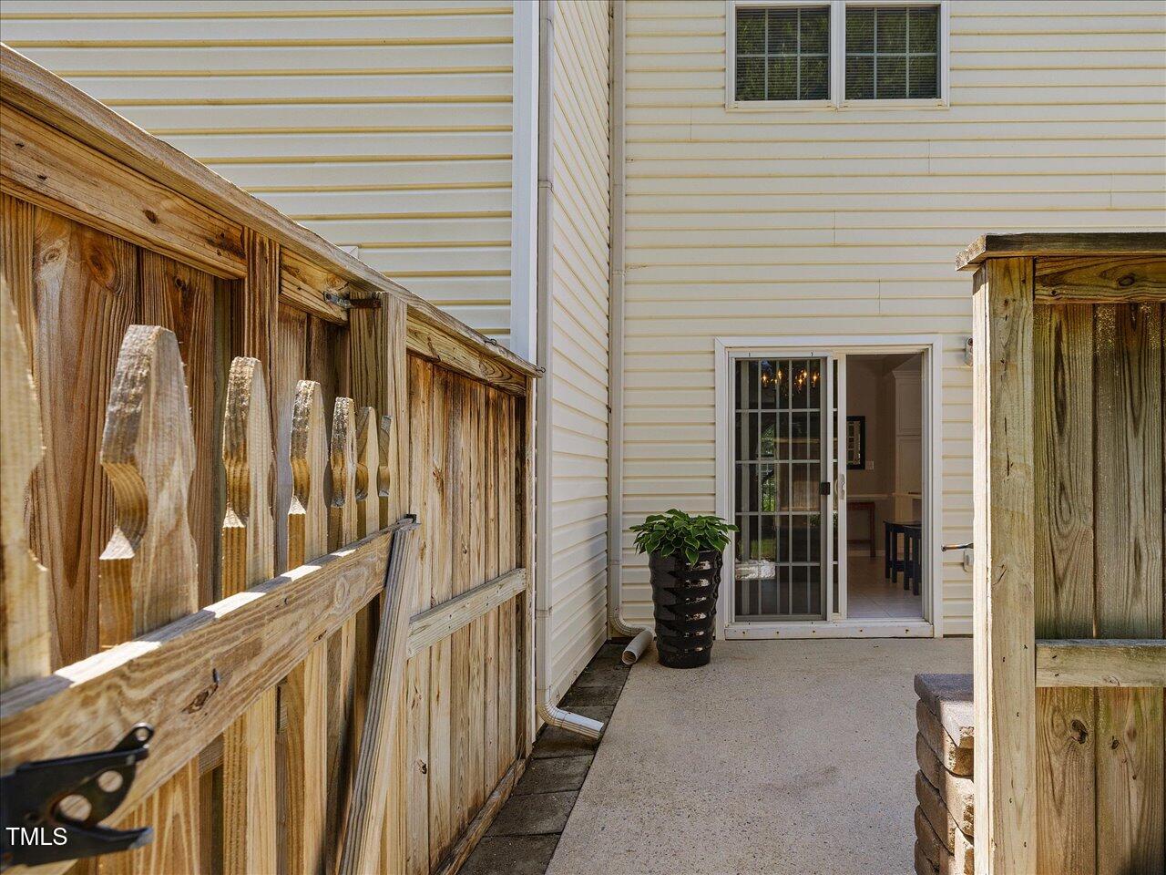 2021 Rivergate Road, Unit 102 Raleigh, NC 27614 - Photo 36 of 42 a view of a house with a potted plant