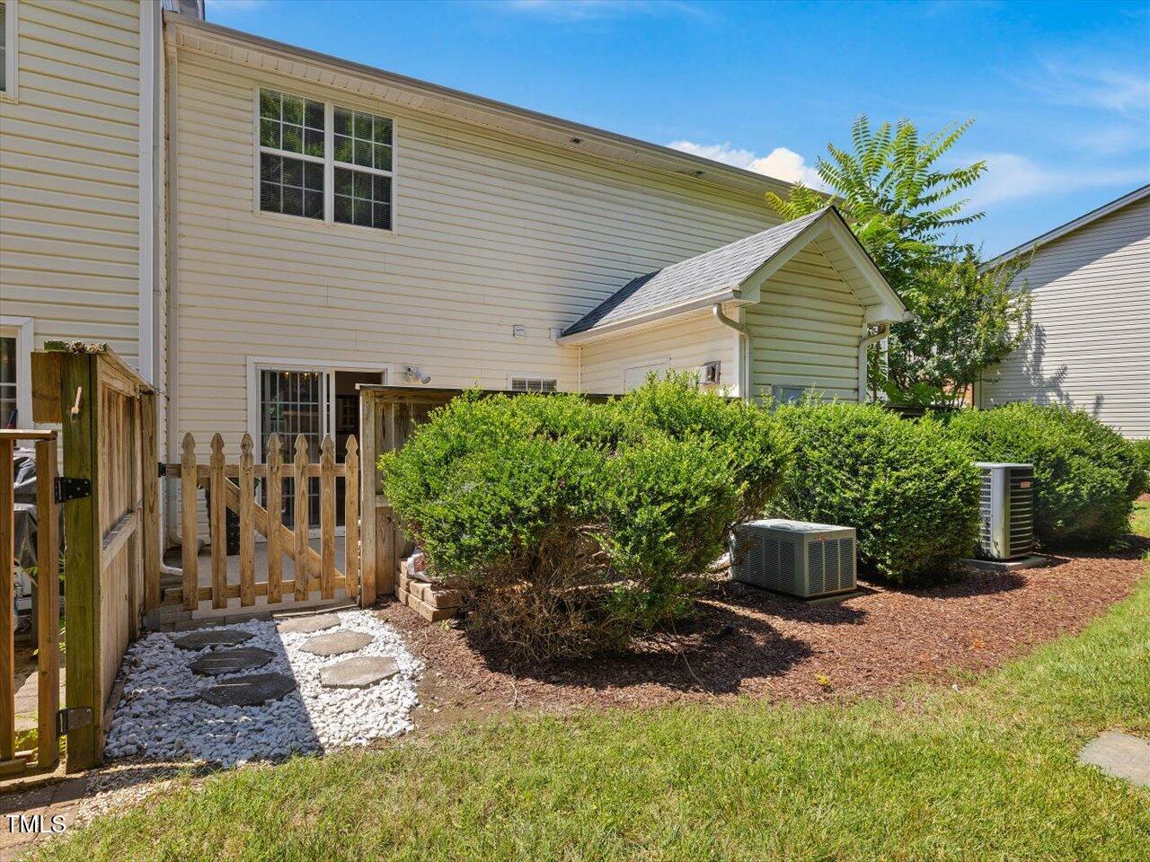 2021 Rivergate Road, Unit 102 Raleigh, NC 27614 - Photo 37 of 42 a view of a backyard with potted plants