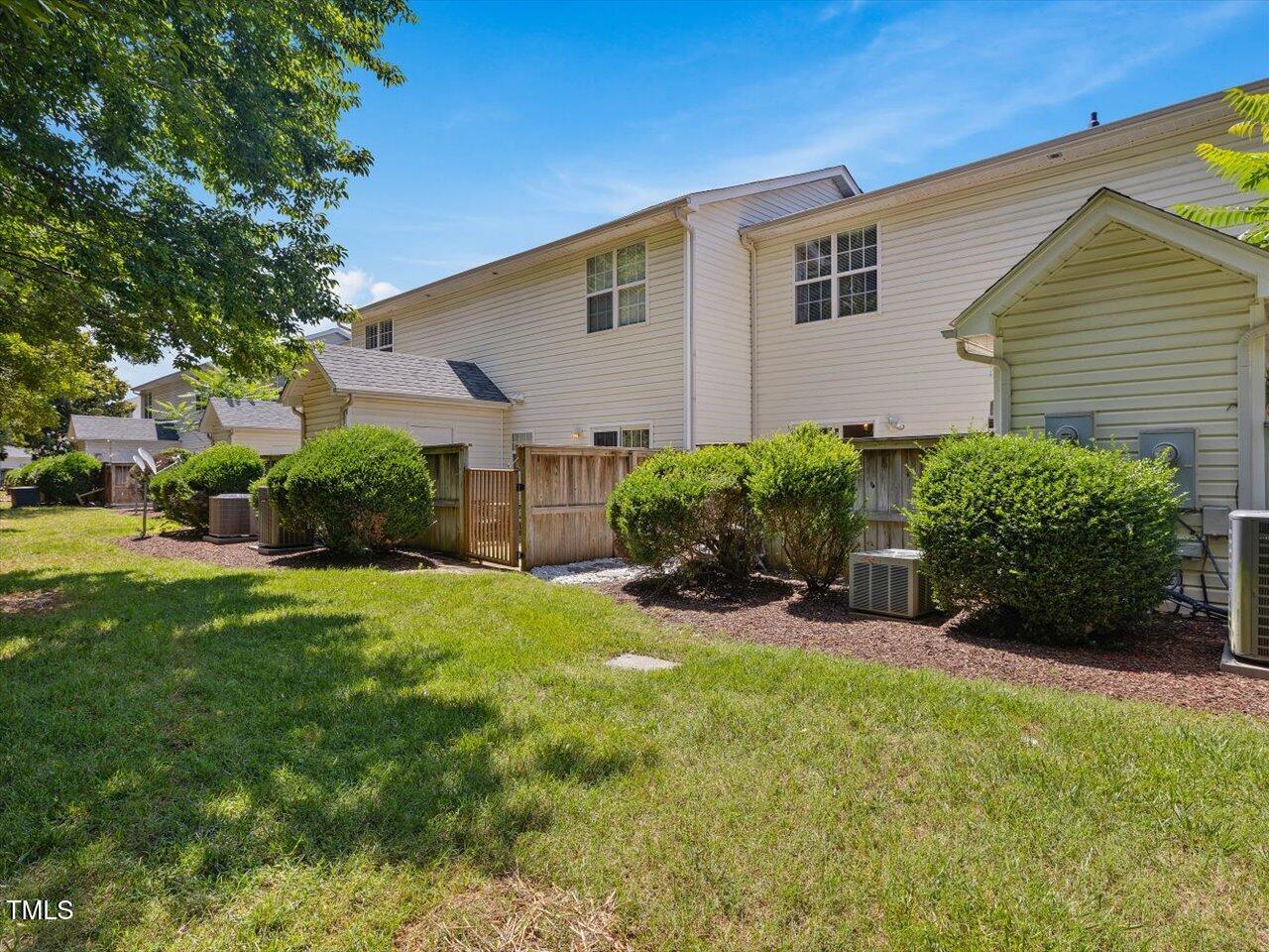 2021 Rivergate Road, Unit 102 Raleigh, NC 27614 - Photo 39 of 42 a view of a house with backyard and sitting area