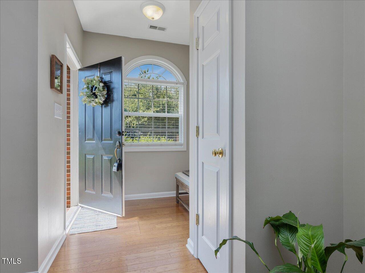 2021 Rivergate Road, Unit 102 Raleigh, NC 27614 - Photo 5 of 42 a view of a hallway with a outdoor space and a window