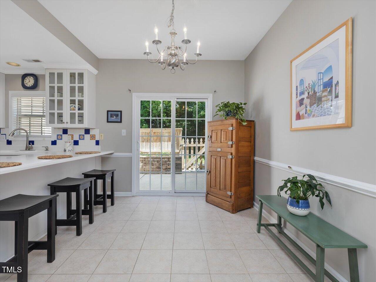 2021 Rivergate Road, Unit 102 Raleigh, NC 27614 - Photo 9 of 42 a dining room with furniture and window