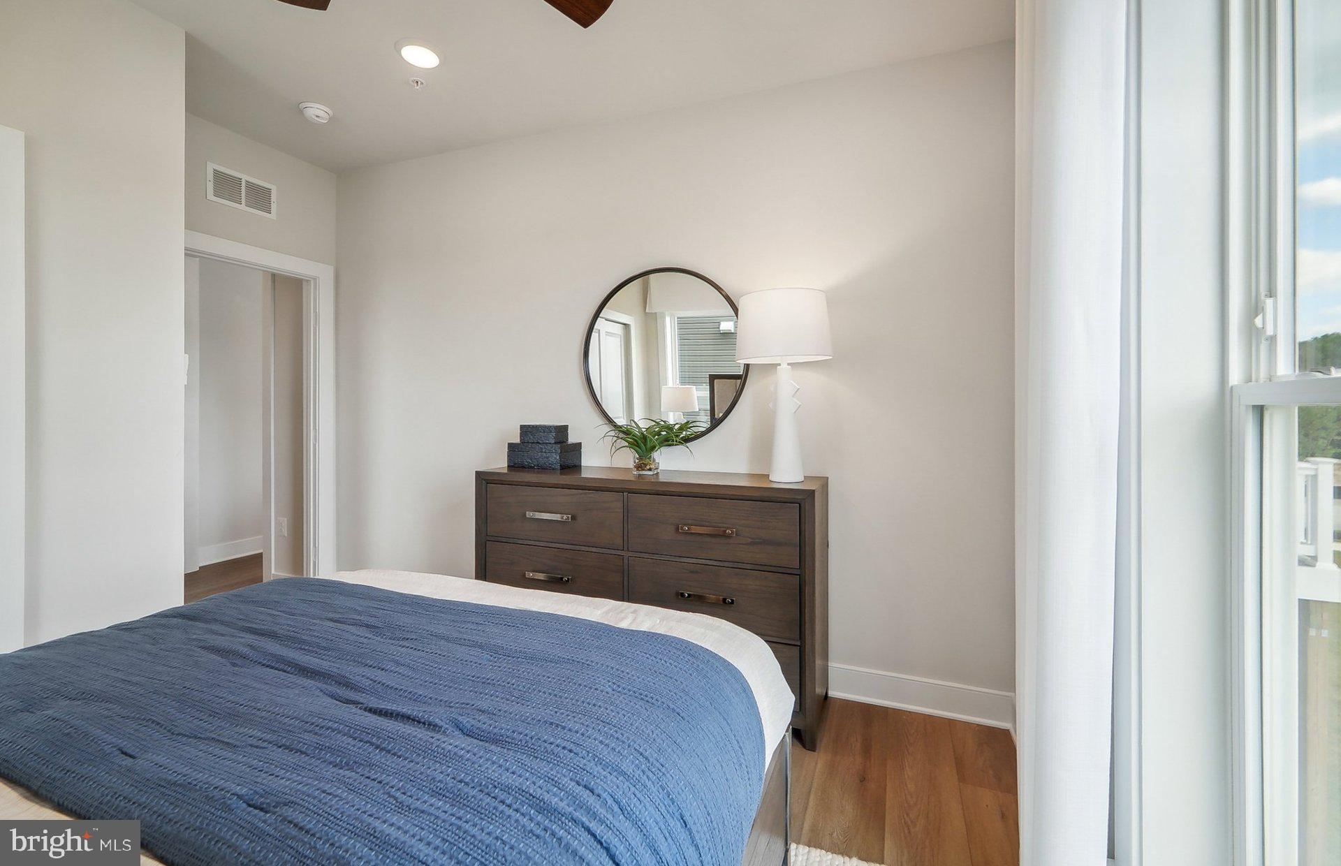 14623 Sourgum Road Boyds, MD 20841 - Photo 17 of 52 a view of a bedroom with wooden floor