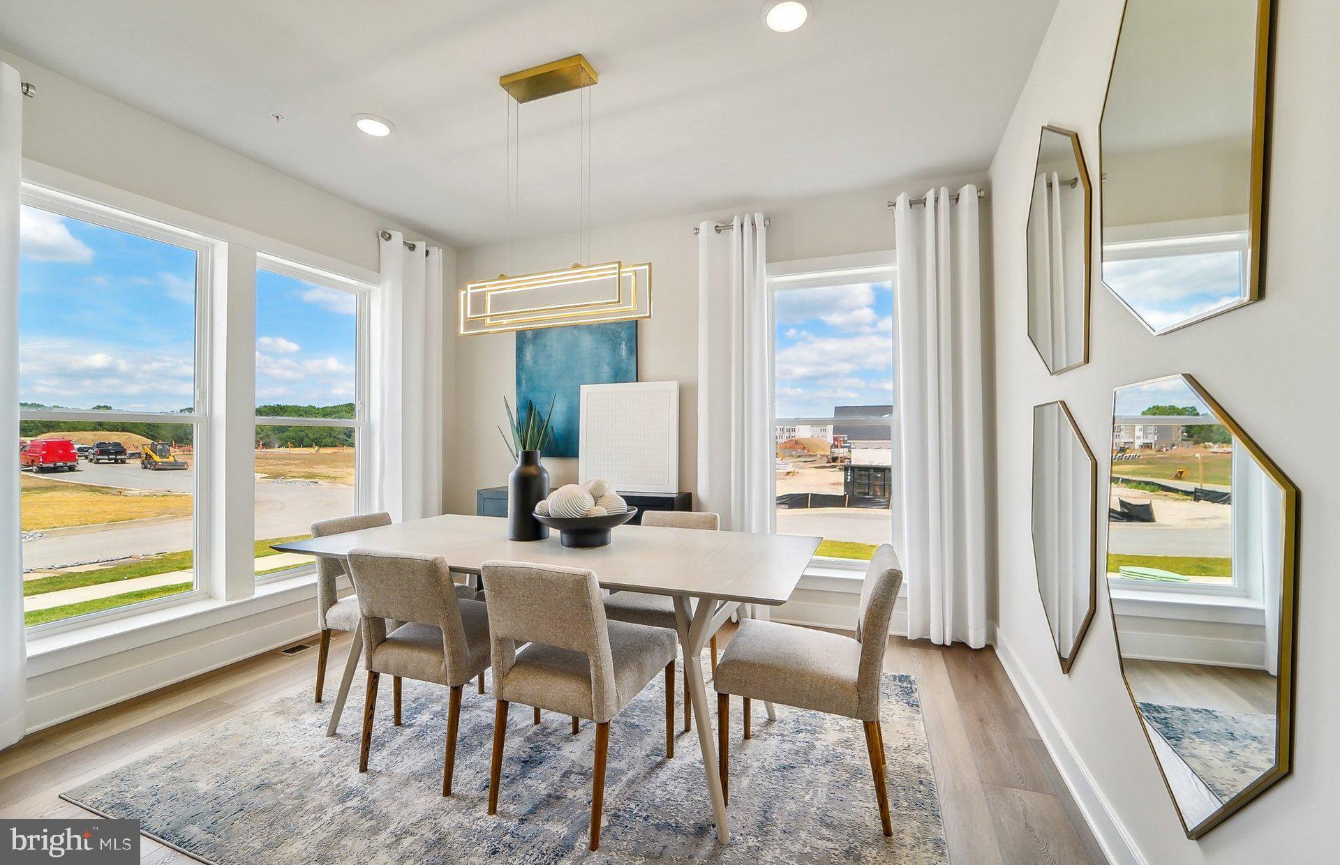 14623 Sourgum Road Boyds, MD 20841 - Photo 3 of 52 a view of a dining room with furniture a chandelier and wooden floor