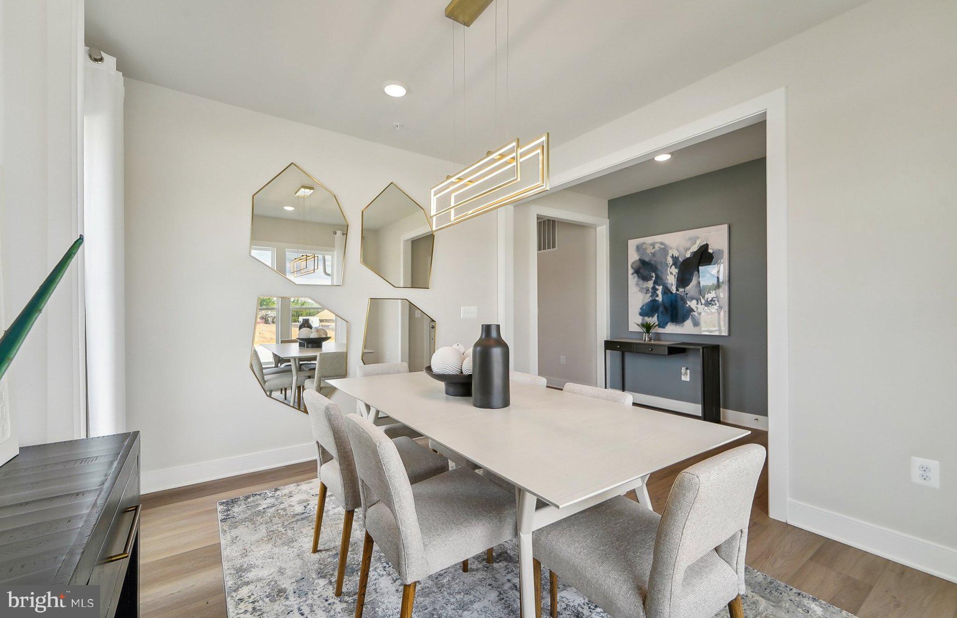 14623 Sourgum Road Boyds, MD 20841 - Photo 4 of 52 a view of a dining room with furniture and wooden floor