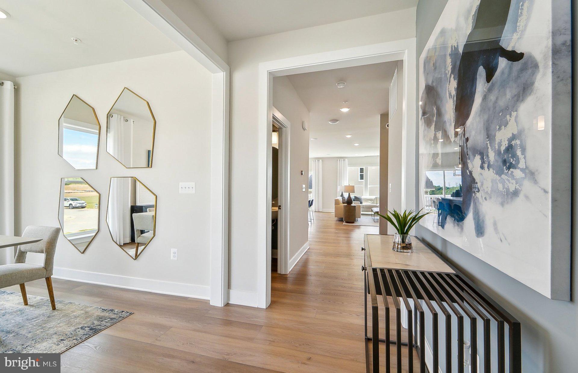 14623 Sourgum Road Boyds, MD 20841 - Photo 5 of 52 a view of a hallway with wooden floor windows and entryway