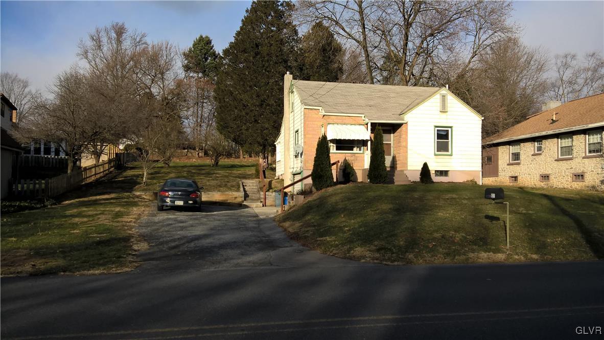 831 Leiszs Bridge Road Reading, PA 19605 - Photo 1 of 13 a view of a white house next to a road and yard