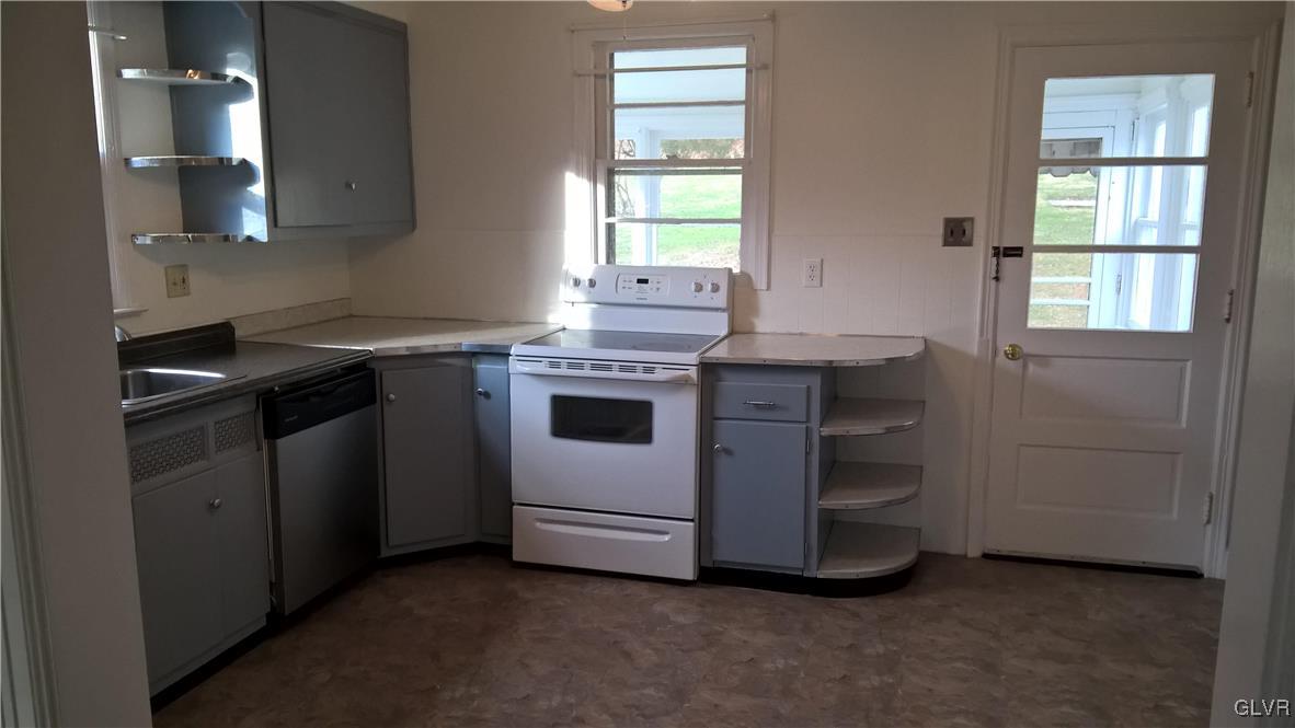 831 Leiszs Bridge Road Reading, PA 19605 - Photo 4 of 13 a kitchen with a stove and a sink