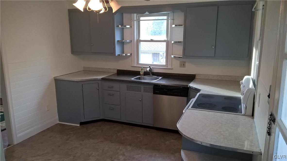 831 Leiszs Bridge Road Reading, PA 19605 - Photo 5 of 13 a kitchen with a sink cabinets and window